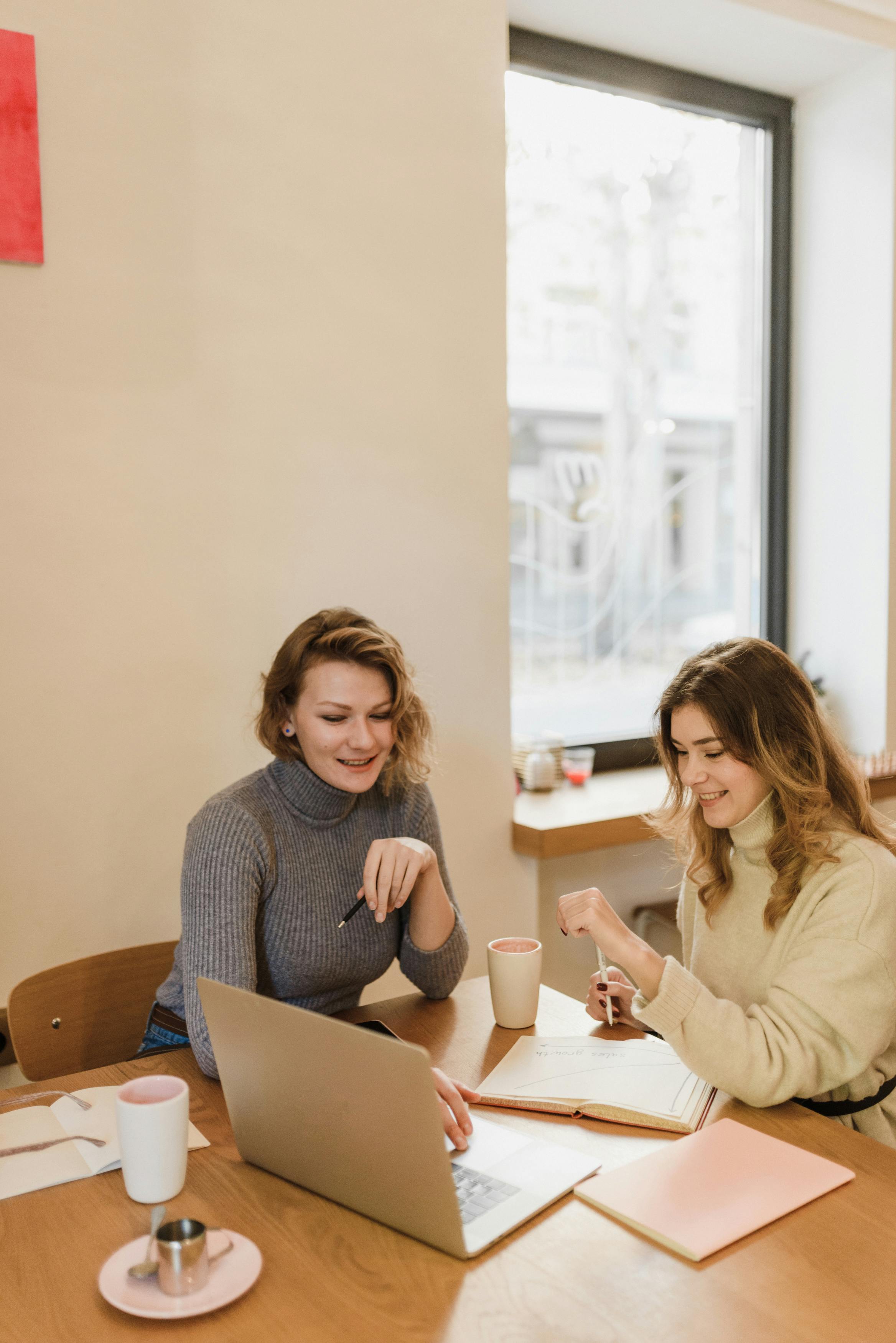 A one-on-one or small-group executive coaching conversation in a relaxed, intimate setting