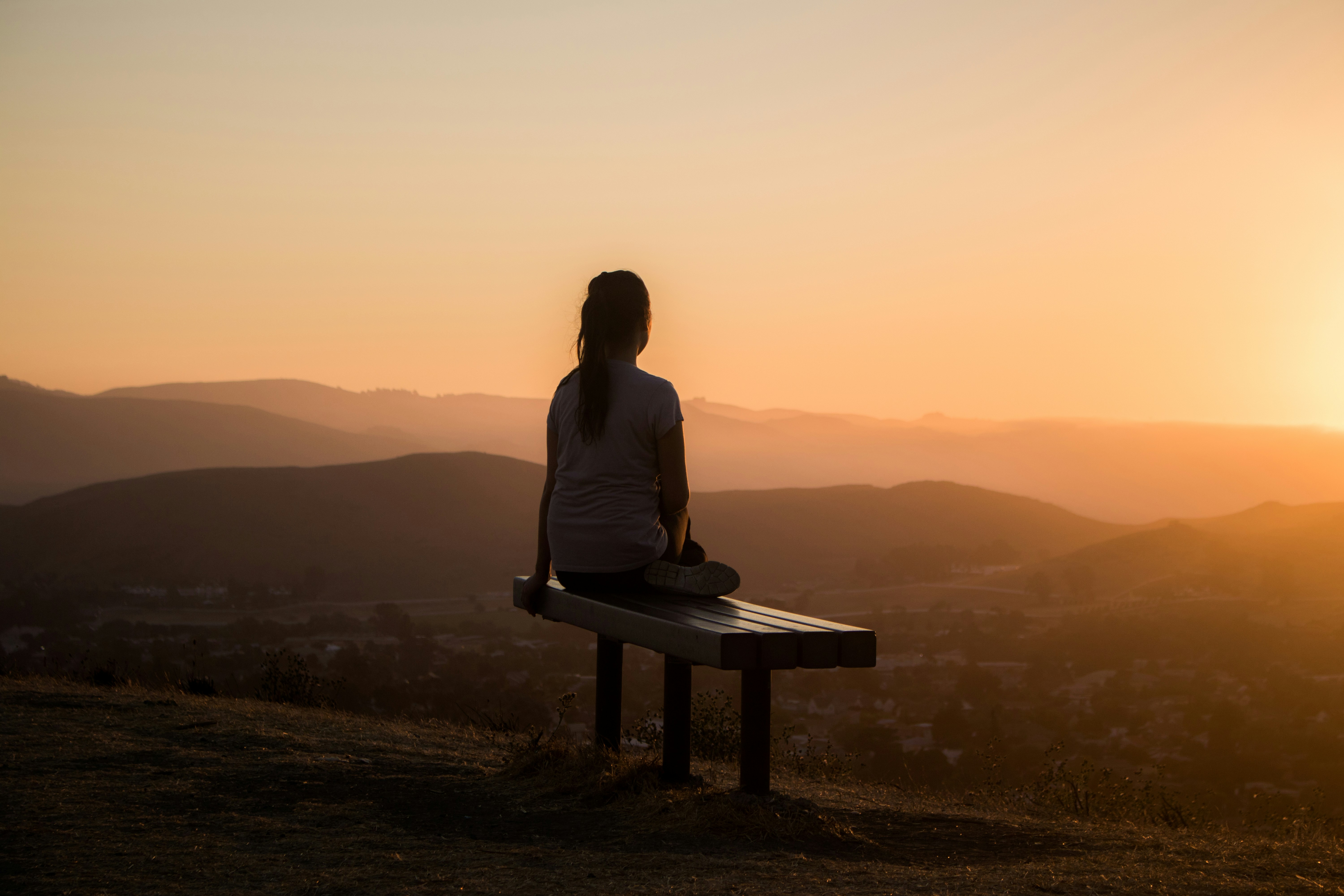 A calming mindfulness moment such as yoga, breathwork, or a candlelit tea ceremony at the retreat